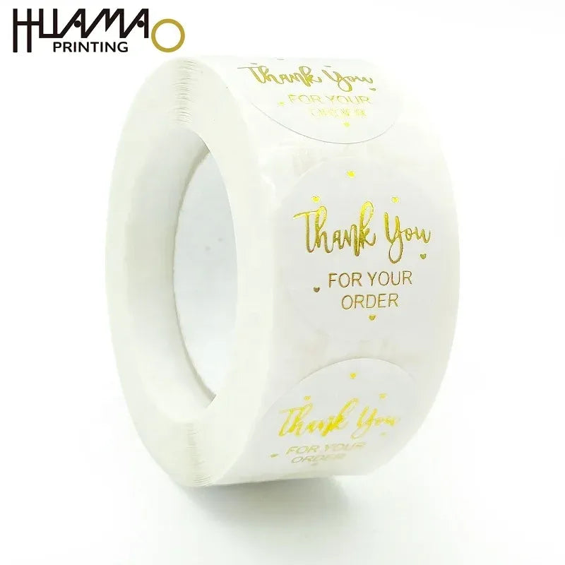 White thank-you sticker roll with gold “Thank You for Your Order” text, waterproof vinyl