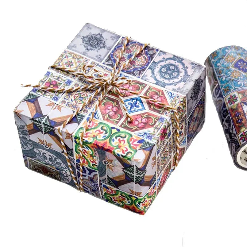 Decorative masking tape on a wrapped gift box with colorful collage patterns