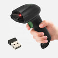 Handheld wireless barcode scanner, black plastic body and green LED, USB dock