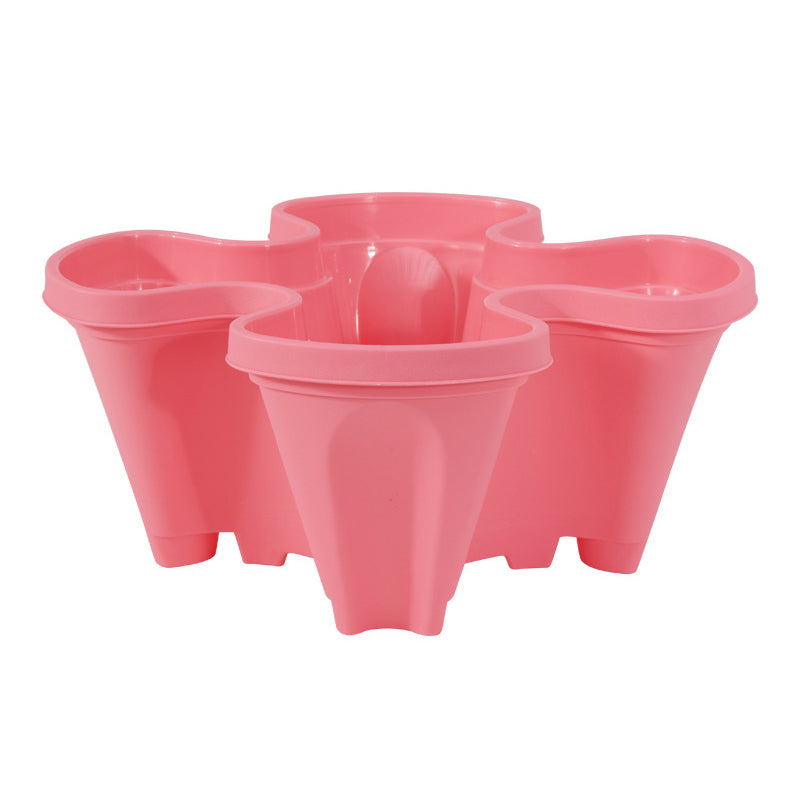 Stackable plastic flower pot set in pink, three connected vertical planters.