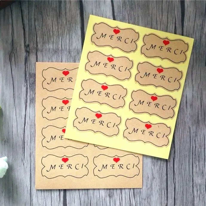 Kraft thank-you label stickers, flower shape with MERCI text and red heart accents