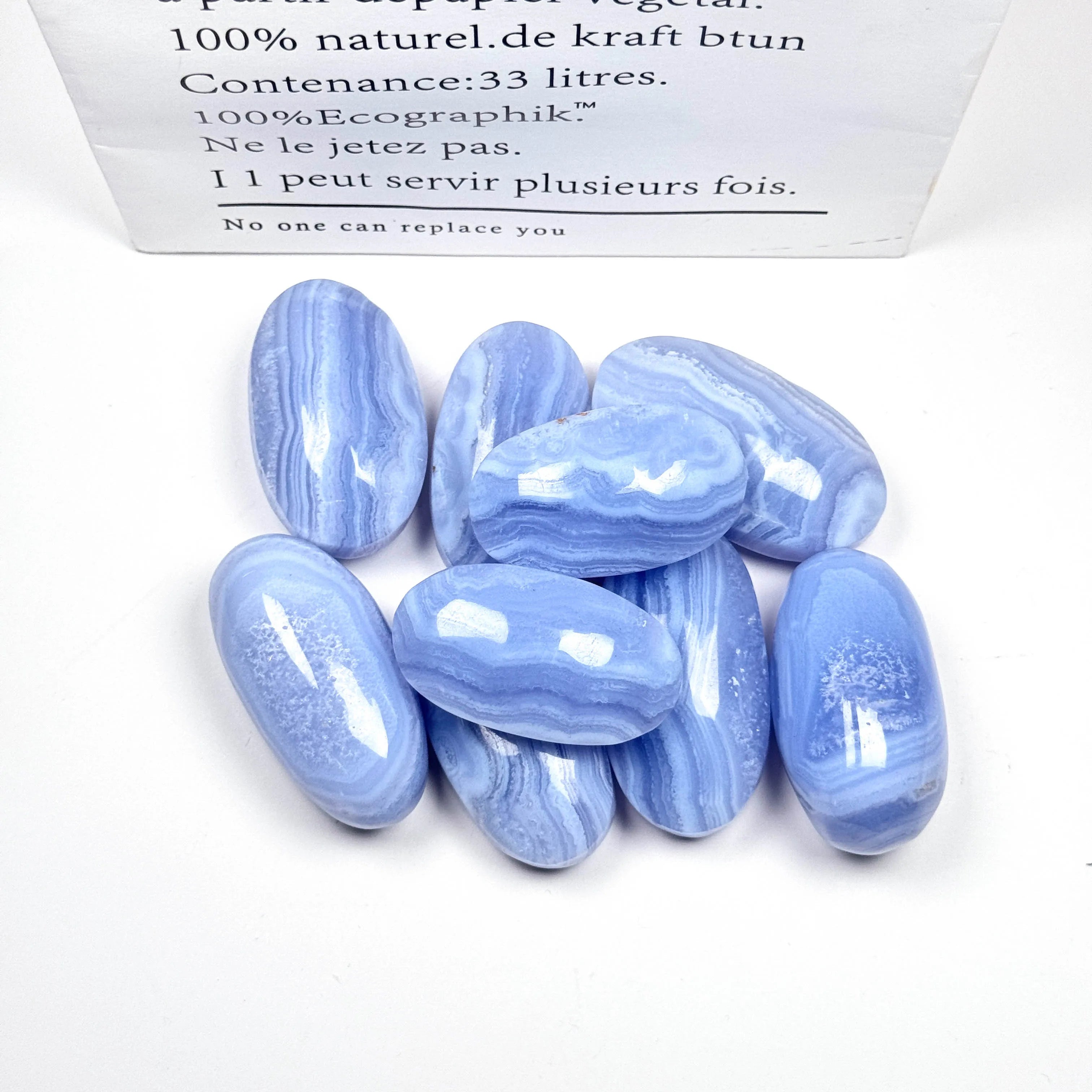 Assorted blue lace agate palm stones, oval tumbled crystals with wavy blue stripes