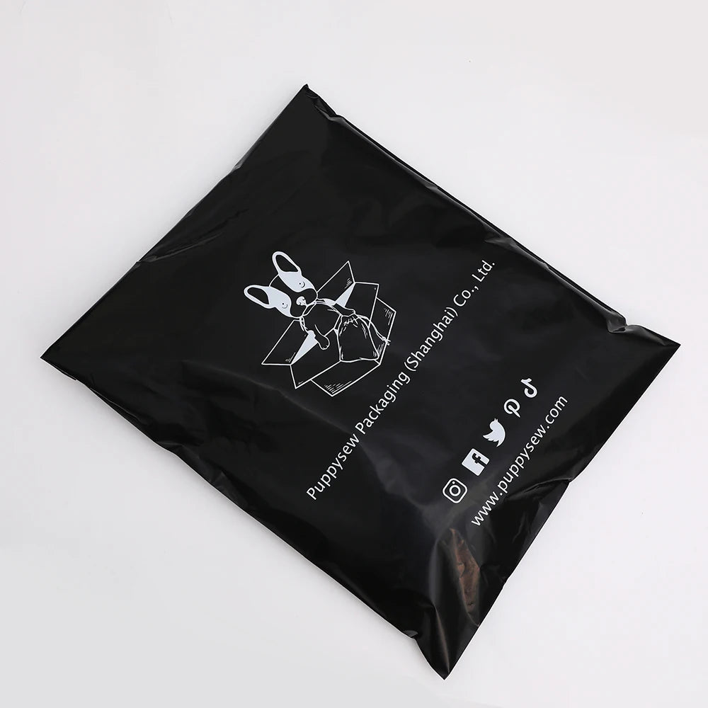Black poly mailer with bunny graphic and printed website and social icons