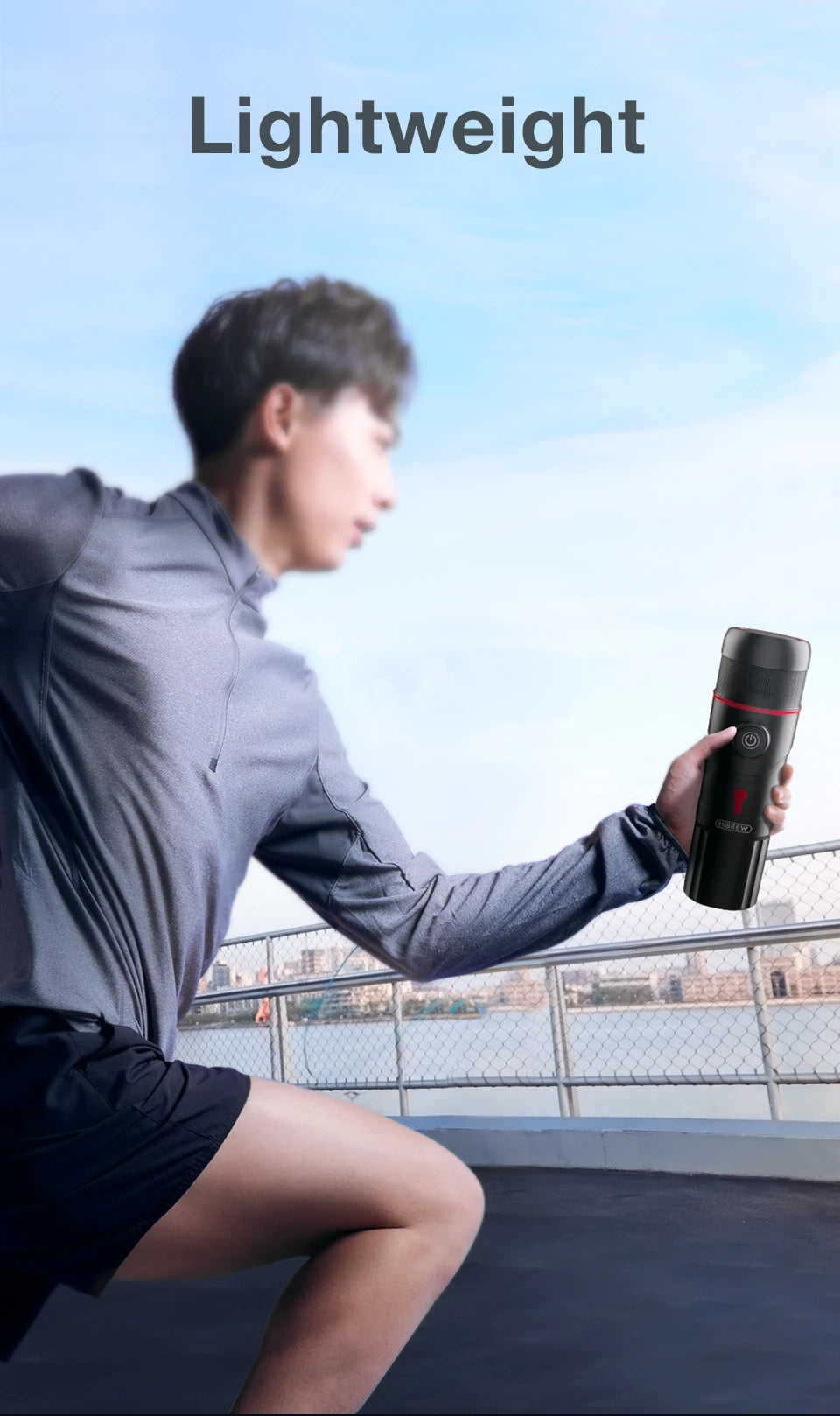 HiBREW portable black travel espresso coffee maker held by a runner, compact and lightweight design.