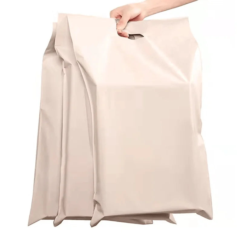 Nude/tan poly mailer envelope with handle, no visible printed design