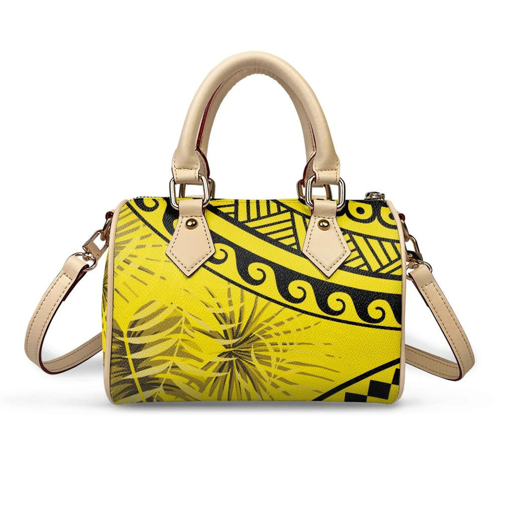 Yellow waterproof PU leather trunk handbag with black Samoan tribal Polynesian patterns and tropical plant prints.