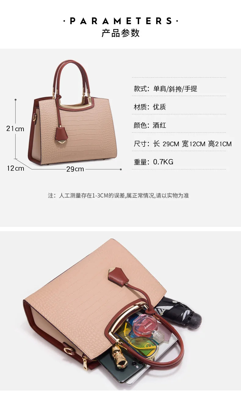 Beige croc-embossed leather tote bag with burgundy trim, top handles, and gold hardware for women.