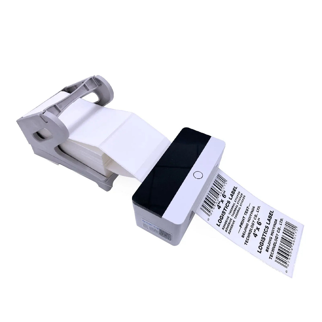 White thermal label stickers on small dispenser with barcode label