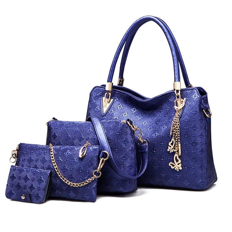 4-piece royal blue embossed handbag set with gold chain, butterfly charm, top handle satchel, and matching pouches.