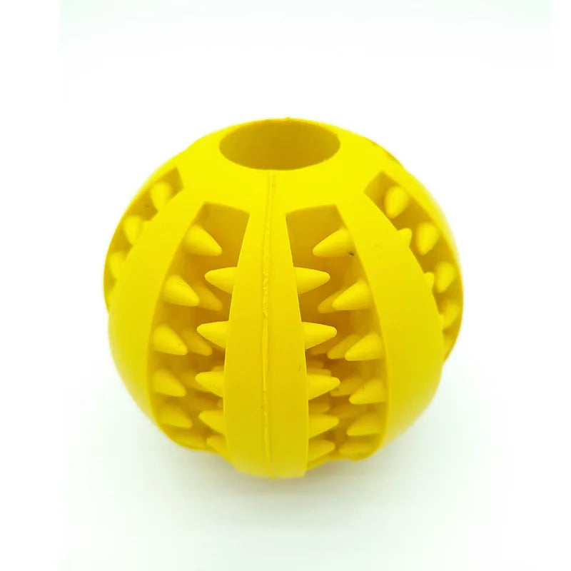 Yellow TPR rubber molar dog chew toy ball for interactive puppy play and teeth cleaning on white background.