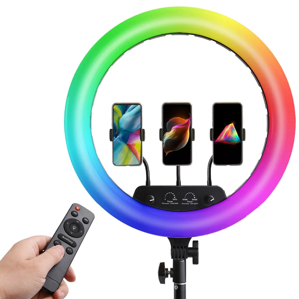 RGB LED ring light with three phone mounts on a stand, including a handheld remote for adjustable lighting.