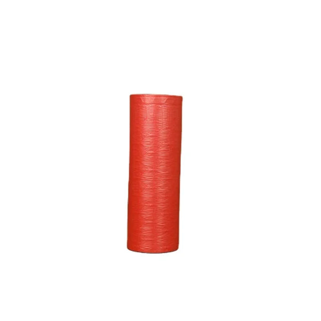 Pink bubble wrap roll, tightly wound, for protective packaging and mailing