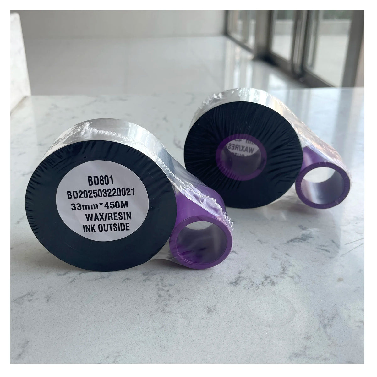Wax/resin ink outside TTO thermal ribbon on silver core with purple outer strip