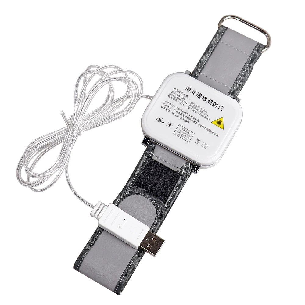 Laser therapy watch with a white square emitter, grey fabric wristband, and a wired USB power connector.