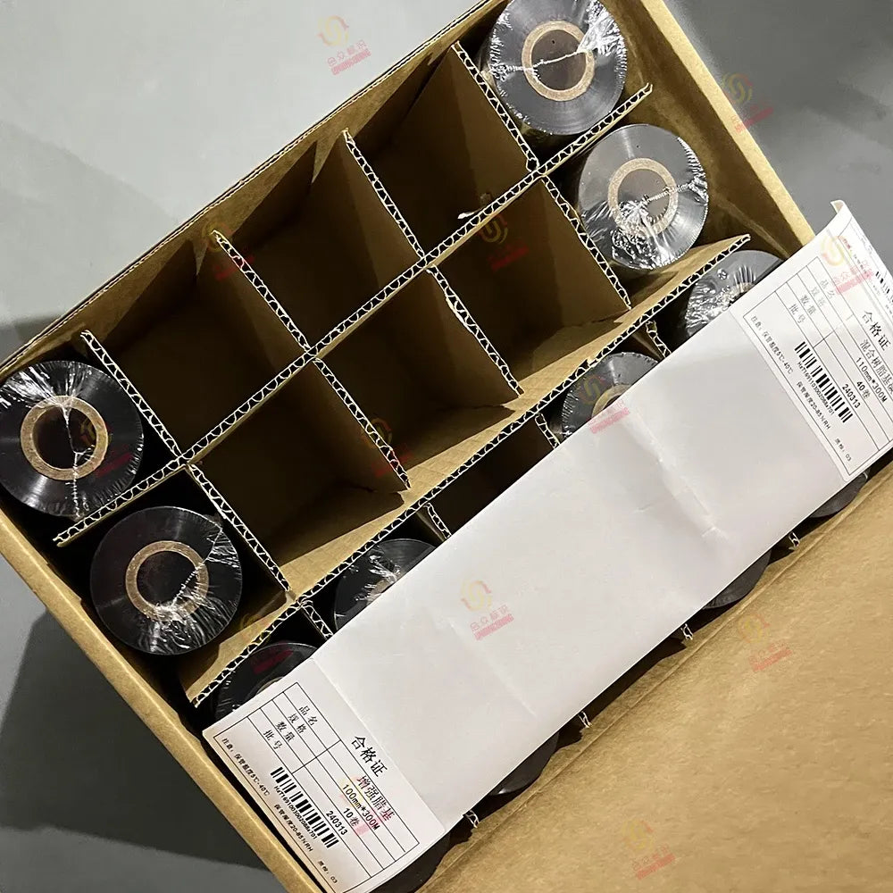 Resin wax barcode printer ribbon rolls in cardboard tray with barcode labels