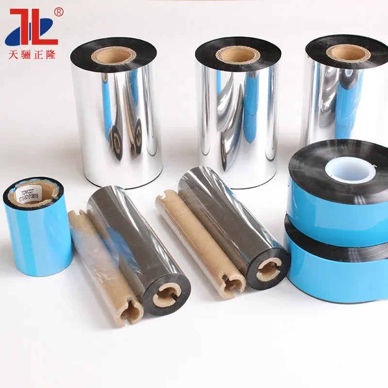Assorted thermal transfer ribbon rolls with black cores and shiny silver wrapping