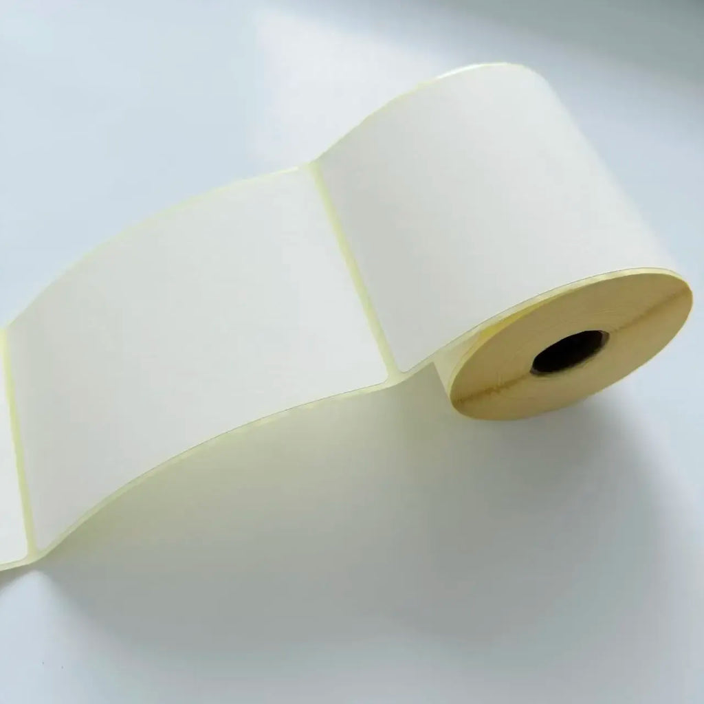 White thermal shipping label roll, adhesive backing and printed area