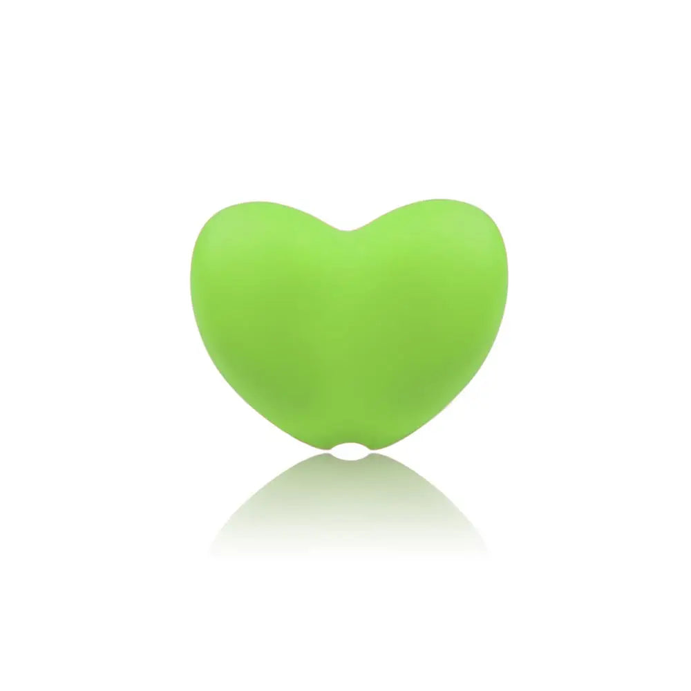 Green heart-shaped silicone baby teething toy for soothing sore gums.