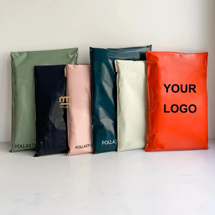 Assorted poly mailers with custom logo, including green, navy, pink, and orange