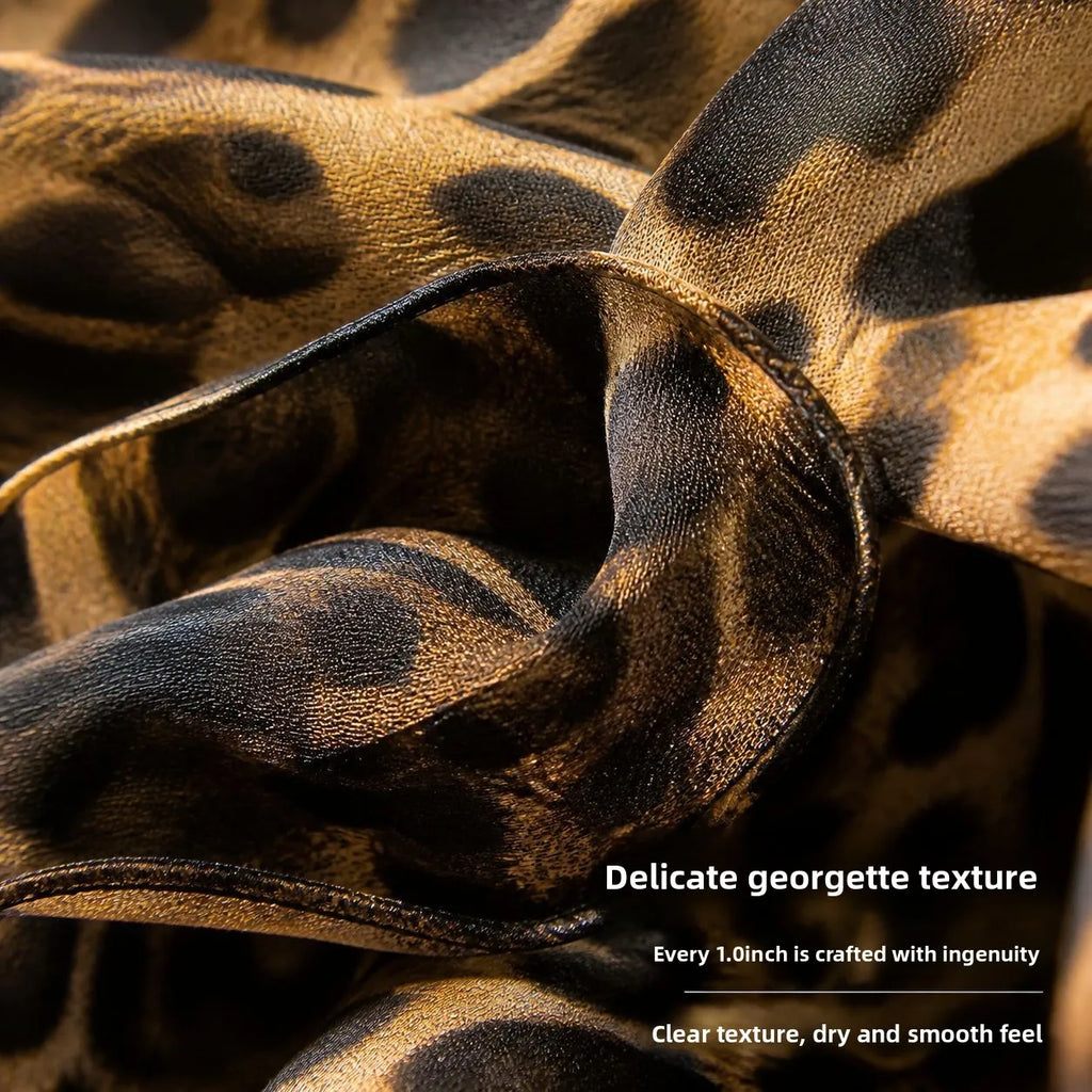 Luxury silk scarf with brown and black leopard print, featuring a delicate, smooth georgette texture.