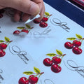 Waterproof die-cut vinyl cherry stickers with transfer tape, glossy red fruit and script