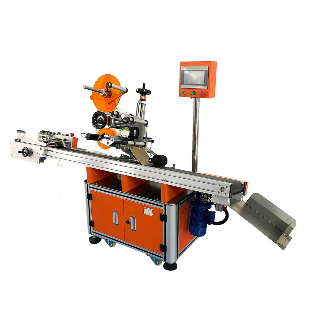 Flat-surface labeling machine with dual reels, guide rail, and orange control cabinet