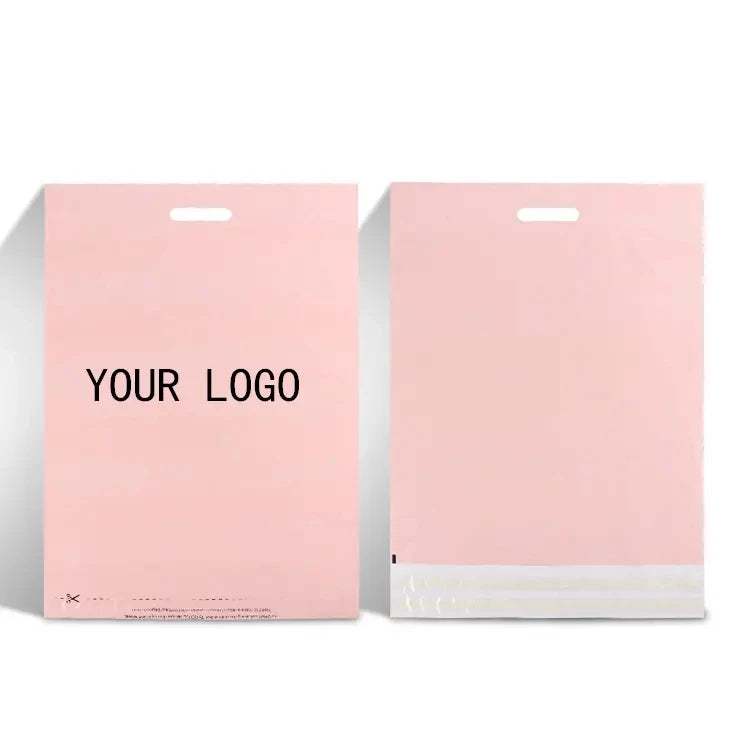 Light pink poly mailer envelopes with handle cutout and “YOUR LOGO” text
