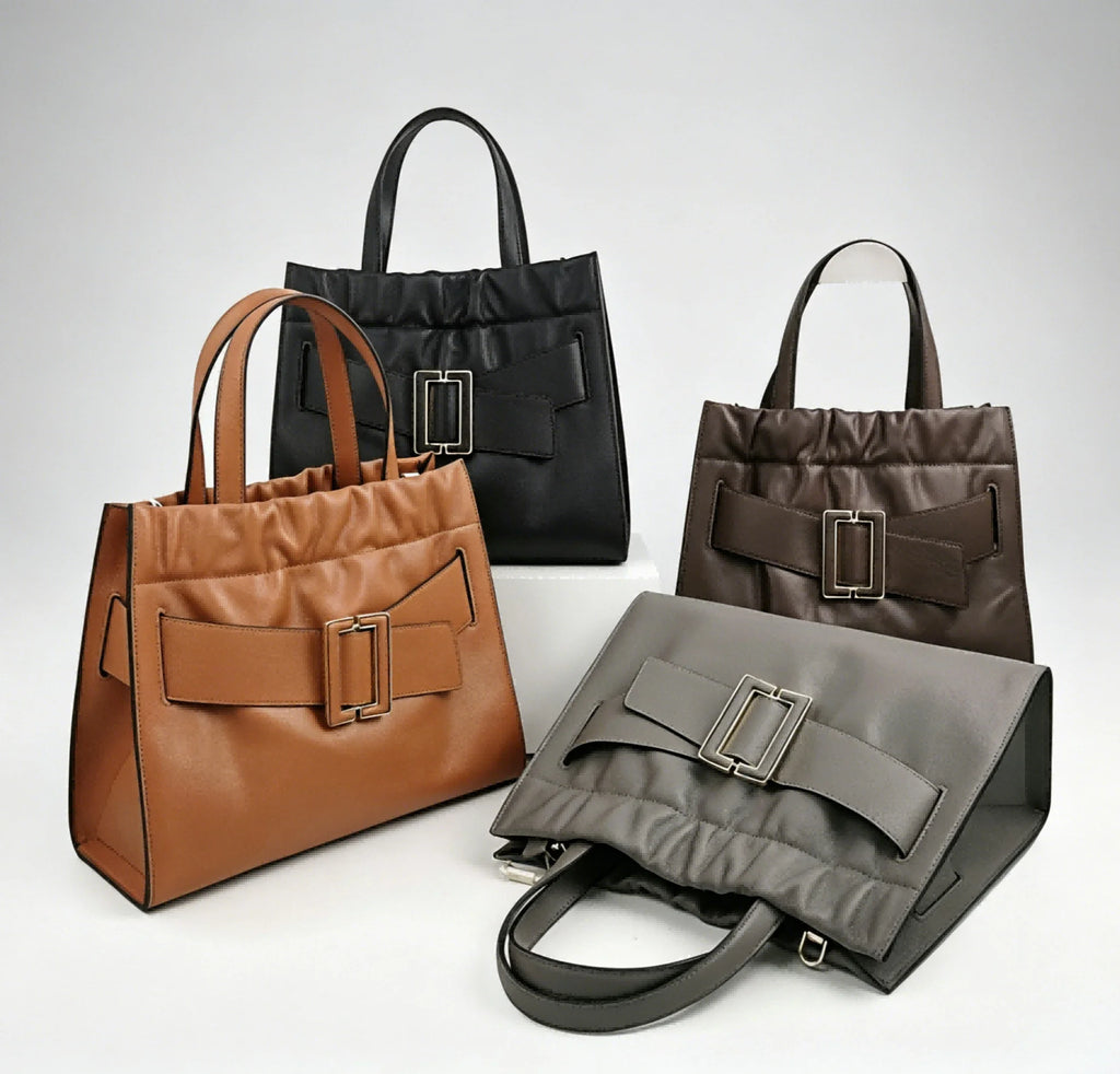 Genuine leather tote handbags in black, tan, brown, and grey with ruched tops and decorative buckle straps for work.