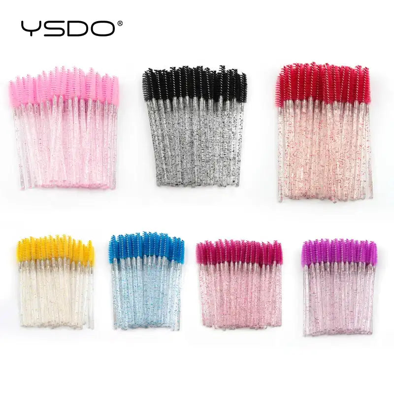 Disposable eyelash brushes with colorful bristles and glittery plastic handles, organized in seven separate bundles.