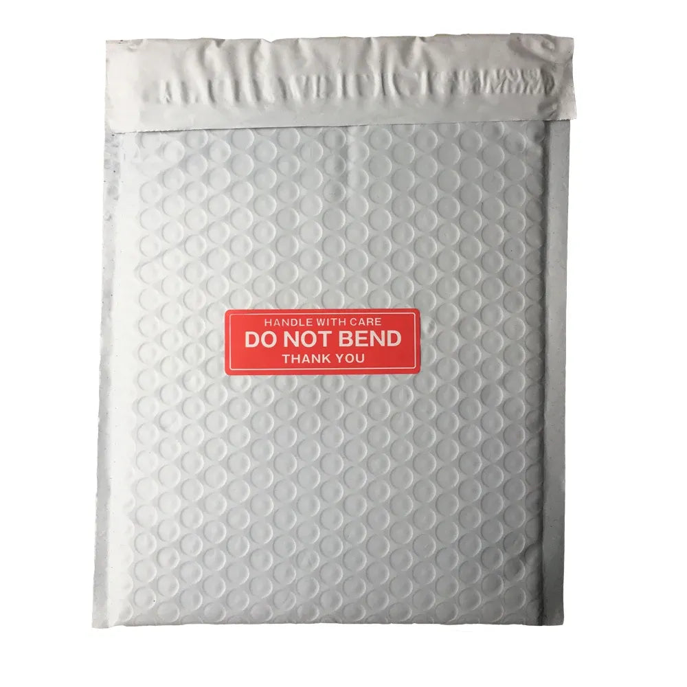 White padded mailer with red “Handle with care—Do not bend” warning sticker