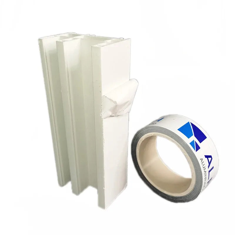 White profile protectors and tape roll, adhesive side visible