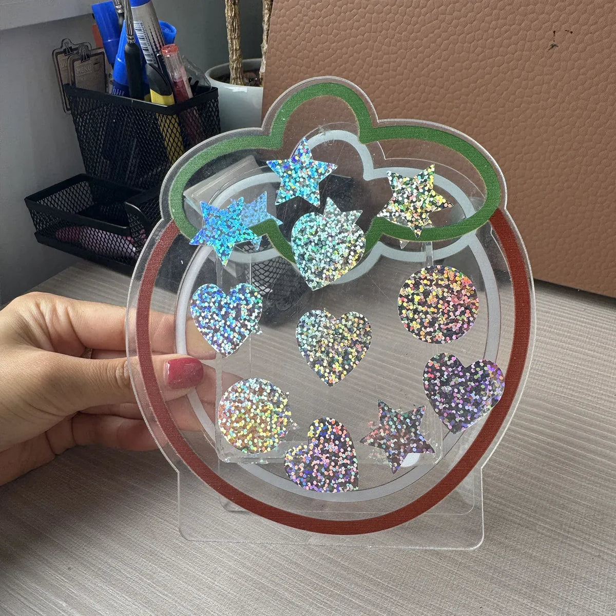 Holographic glitter heart and star stickers on transparent sheet