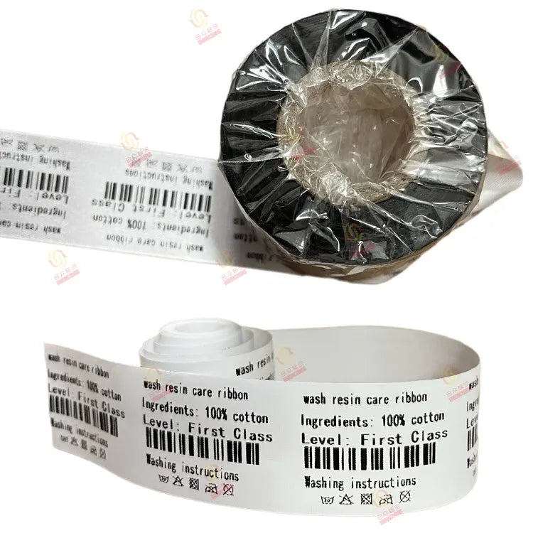 Black thermal transfer ribbon roll with printed wash-care ribbon tape and barcode labels