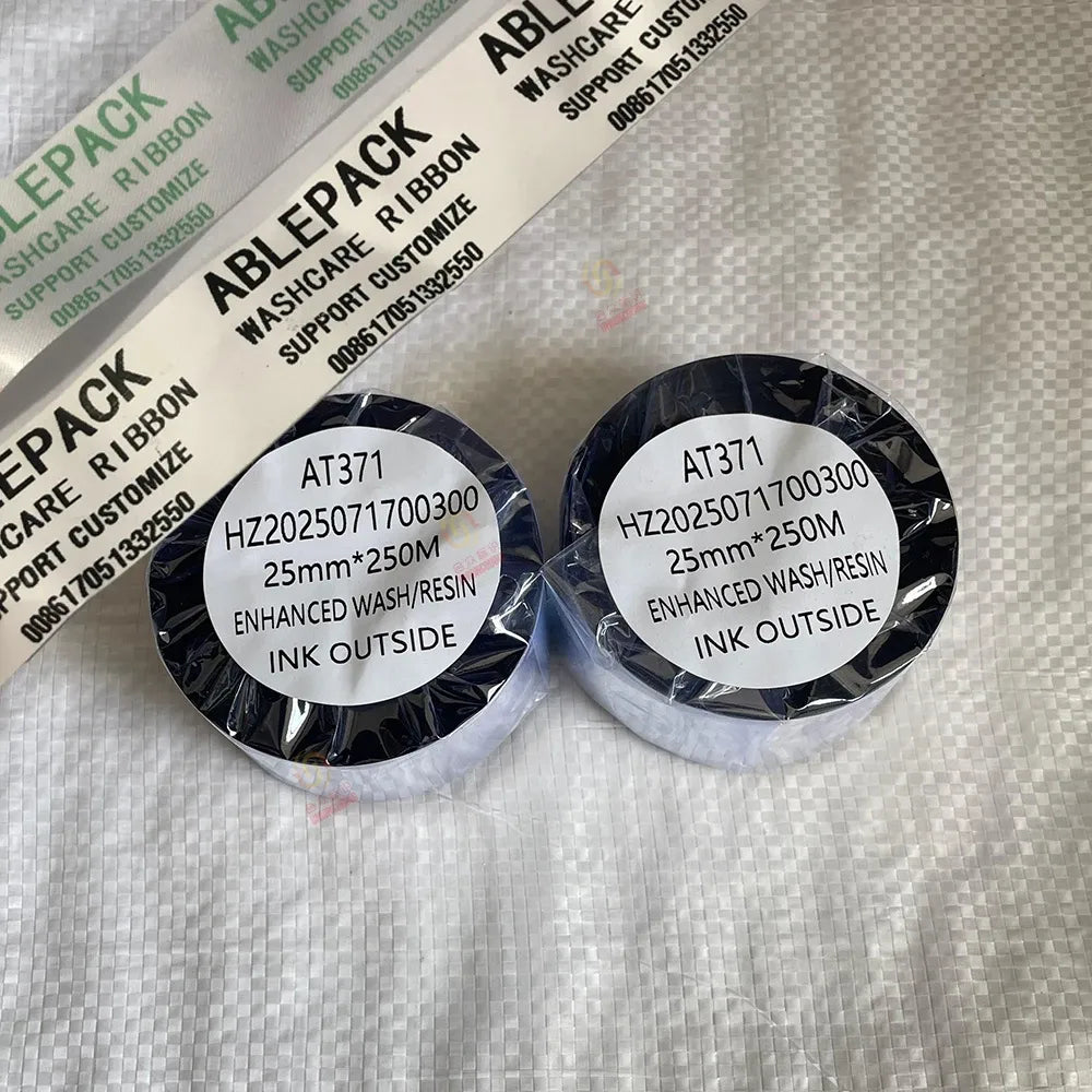 Thermal transfer wax resin ribbon spools labeled 25mm ink outside, black