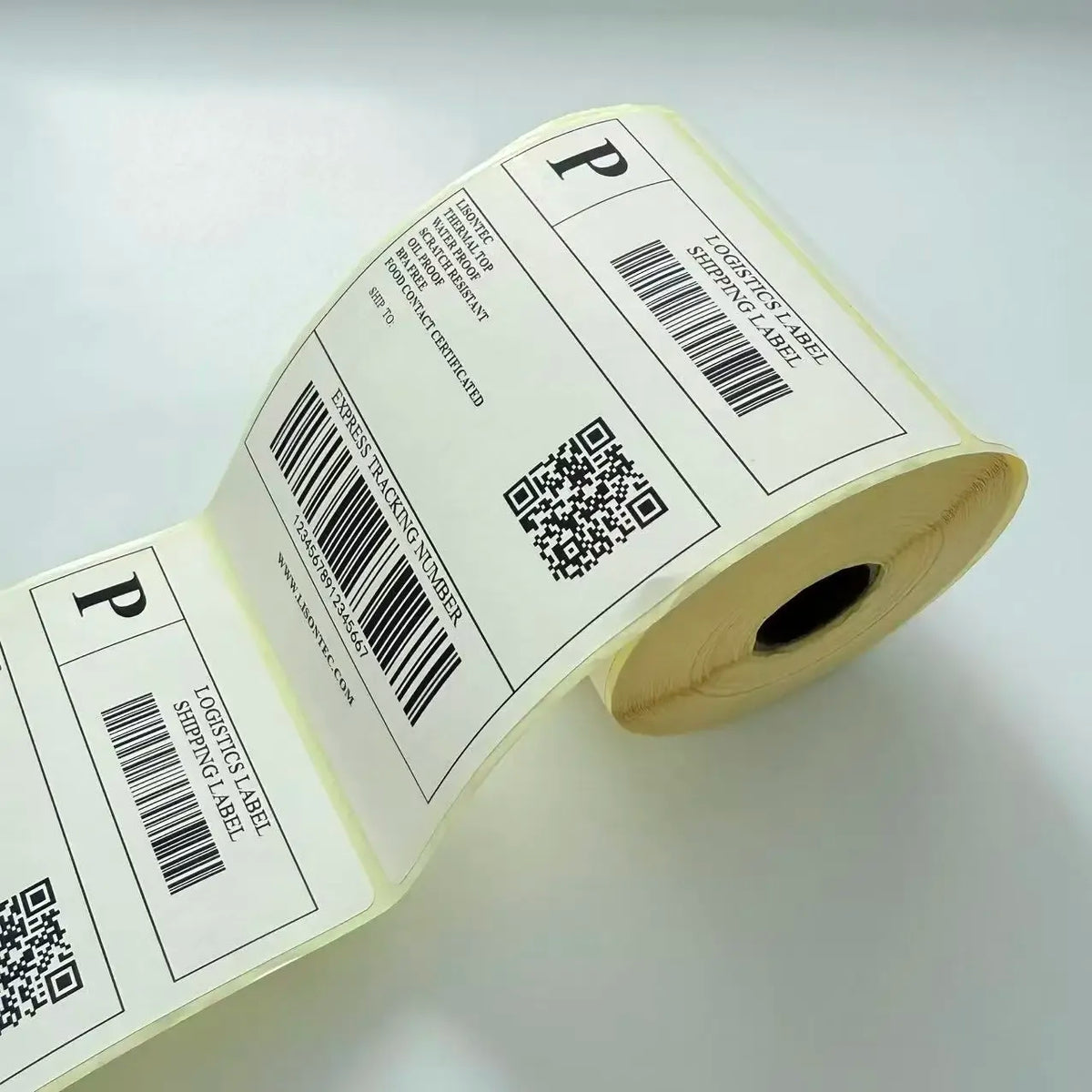 White thermal shipping labels on roll, barcodes and QR codes