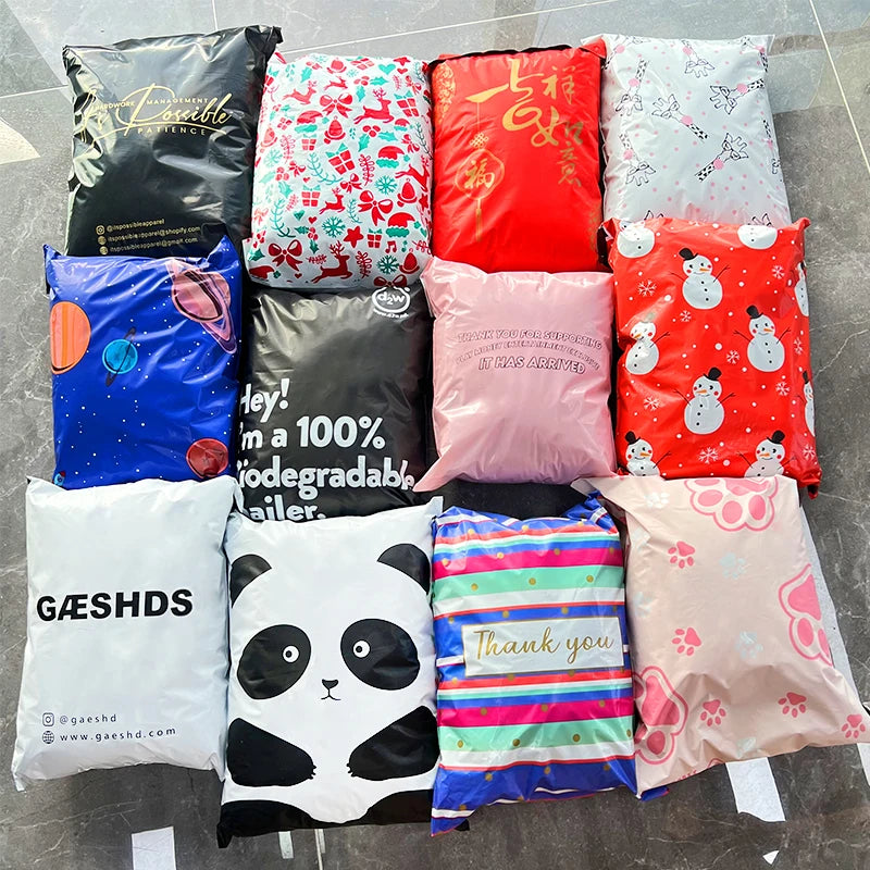 Assorted colorful compostable poly mailer bags with panda, snowman, and thank-you prints