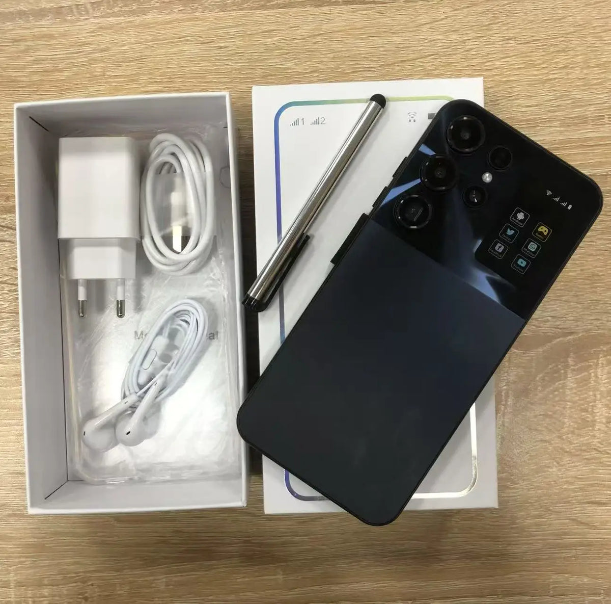 Black smartphone with box and bundled charging cable