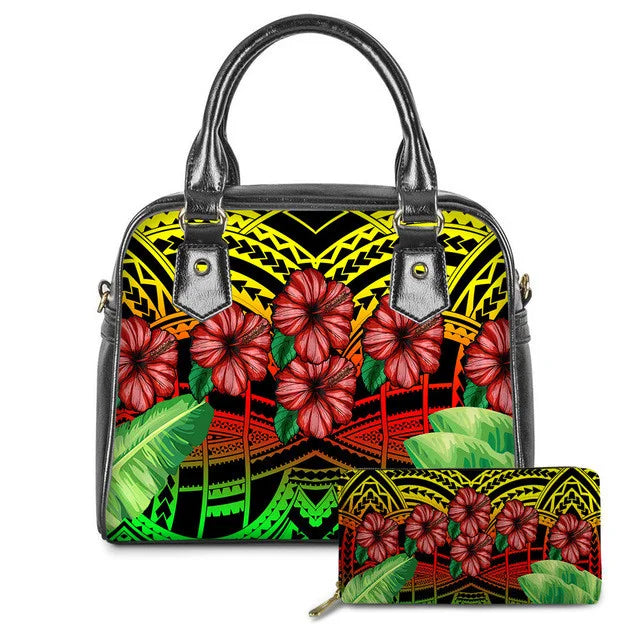 Colorful Polynesian tribal print leather handbag and wallet set with red hibiscus flowers and tropical green leaves.