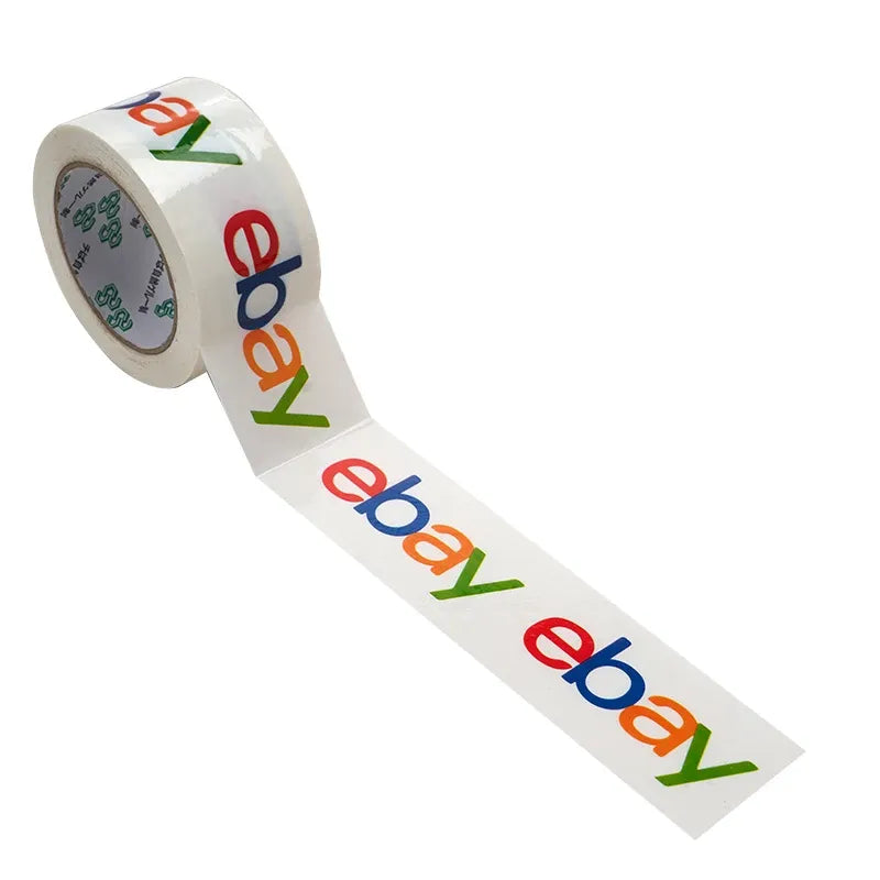 Angled view of white packing tape roll with colorful eBay logo print and inner core