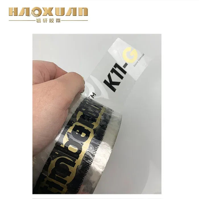Clear tape roll with bold black printed lettering