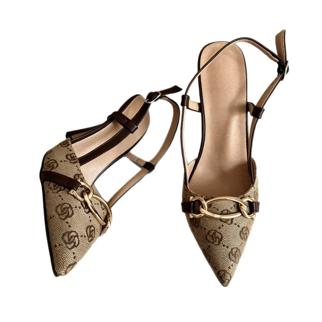 This Fashionable Sandal Features a  Rhinestone Bow Design. It Has a Unique, Slender Heel Style and Is Versatile