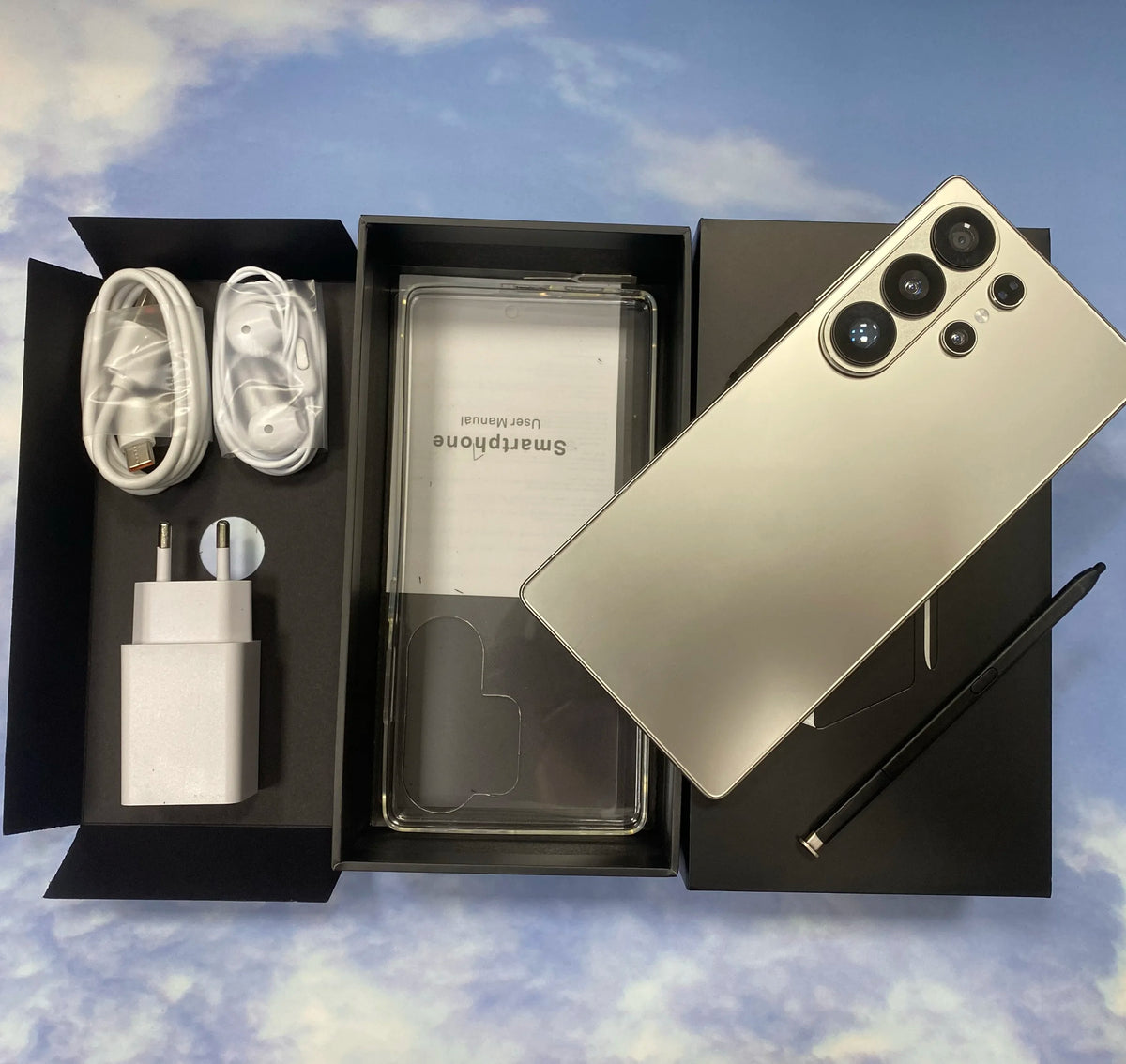 Gold smartphone back with quad cameras and smooth matte finish, shown with protective covers