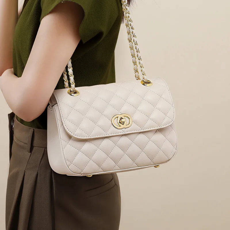 Off-white quilted genuine leather shoulder bag with gold chain strap and turn-lock flap closure for women.