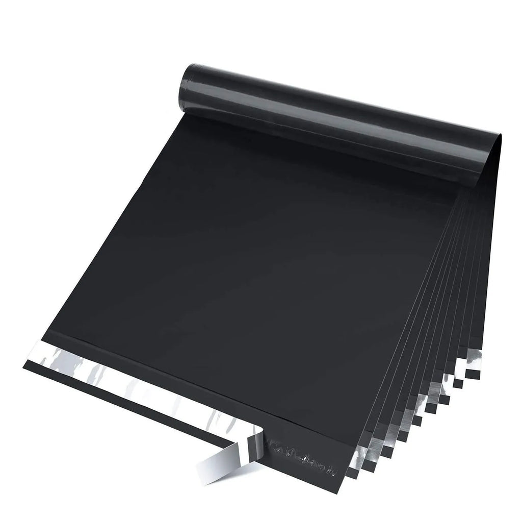 Black poly mailer shipping envelope stack with glossy finish and straight edges