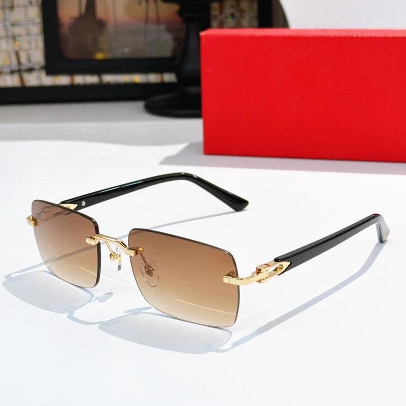 Luxury rimless rectangle sunglasses with gold titanium frame, black acetate temples, and brown gradient lenses.