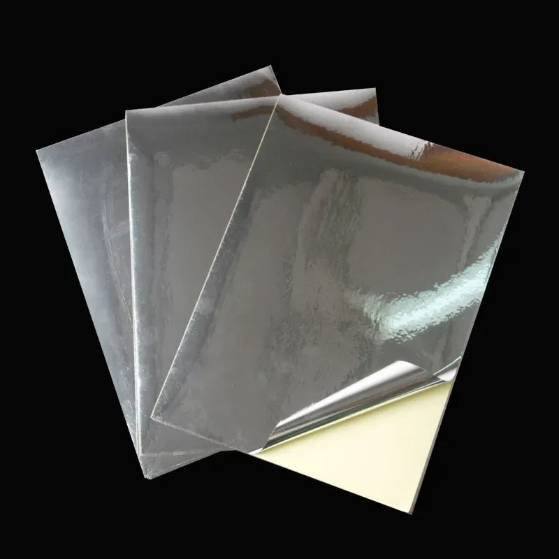 Stack of glossy silver self-adhesive PET sheets for A4 label printing