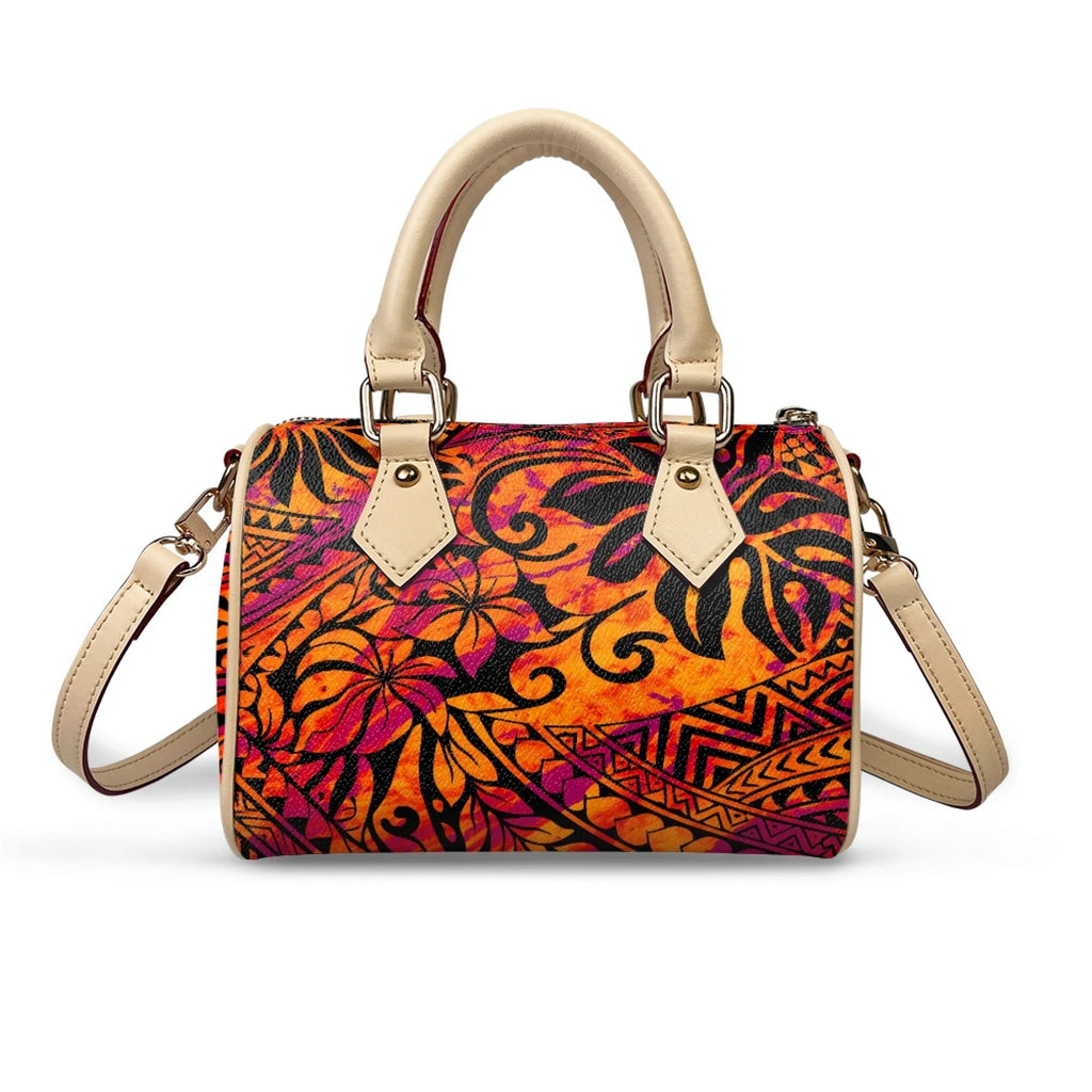 Orange and purple tribal print pillow handbag with beige top handles and detachable shoulder strap.