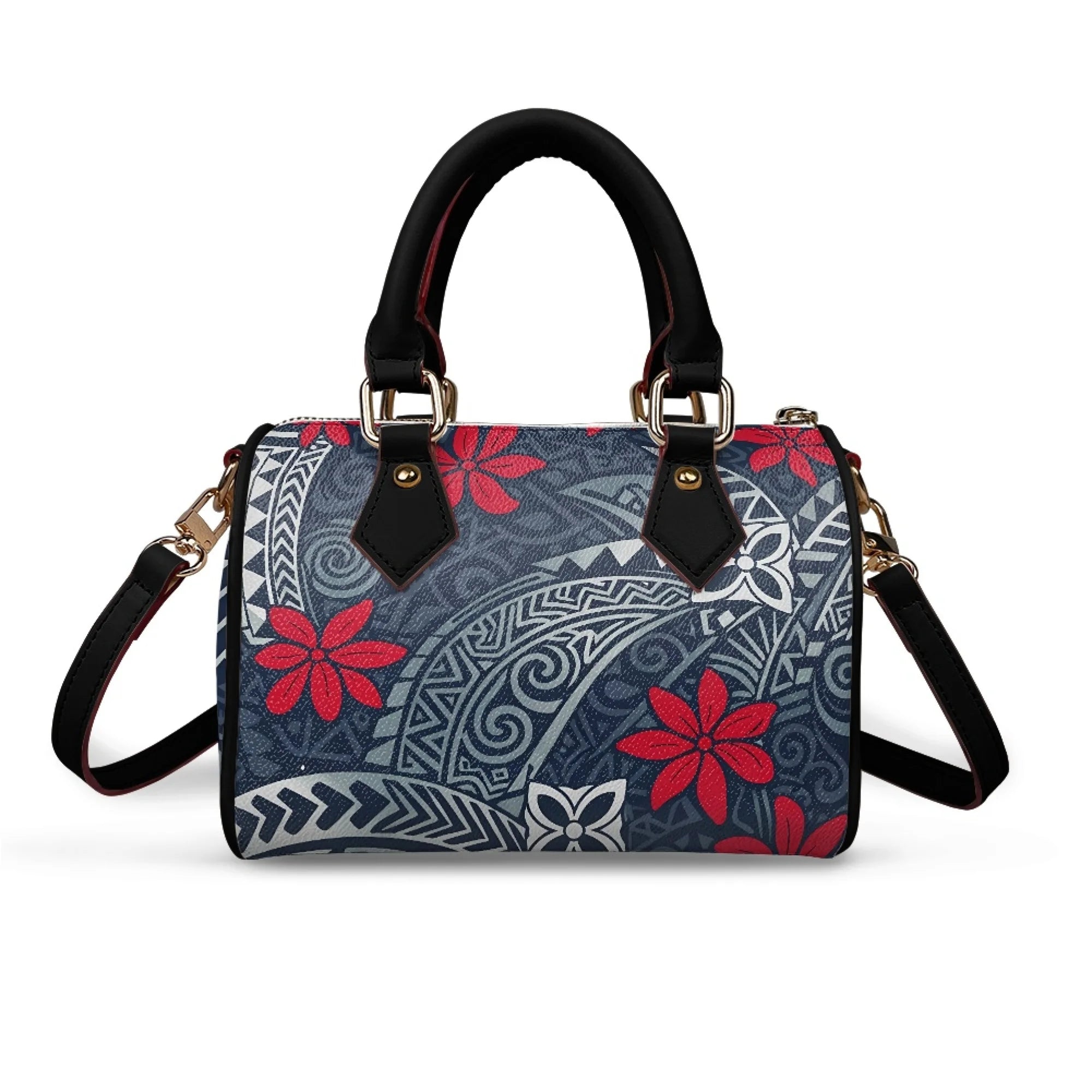 Pillow-shaped handbag with navy blue tribal print, red floral accents, black handles, and detachable shoulder strap.