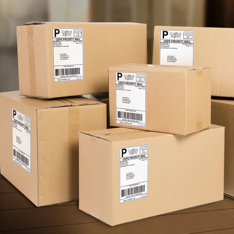 White shipping labels on brown cardboard boxes for packaging