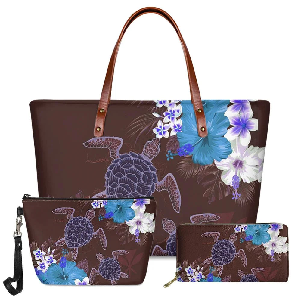 3-piece handbag set, brown faux leather with blue Polynesian turtle and floral print, brown shoulder straps and trunks.